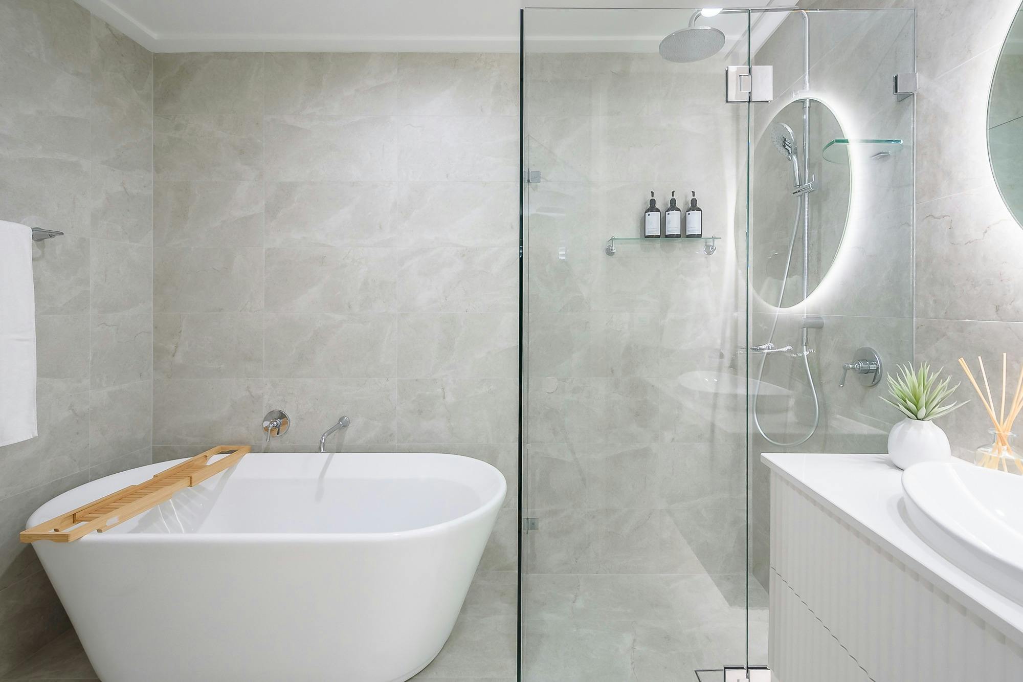 bathroom showing vanity, bath and shower