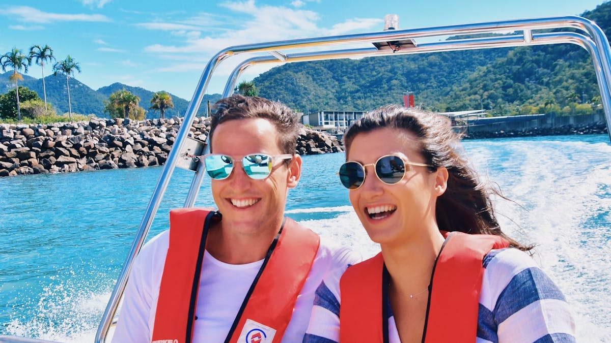 Couple on a boat heading off for an adventure