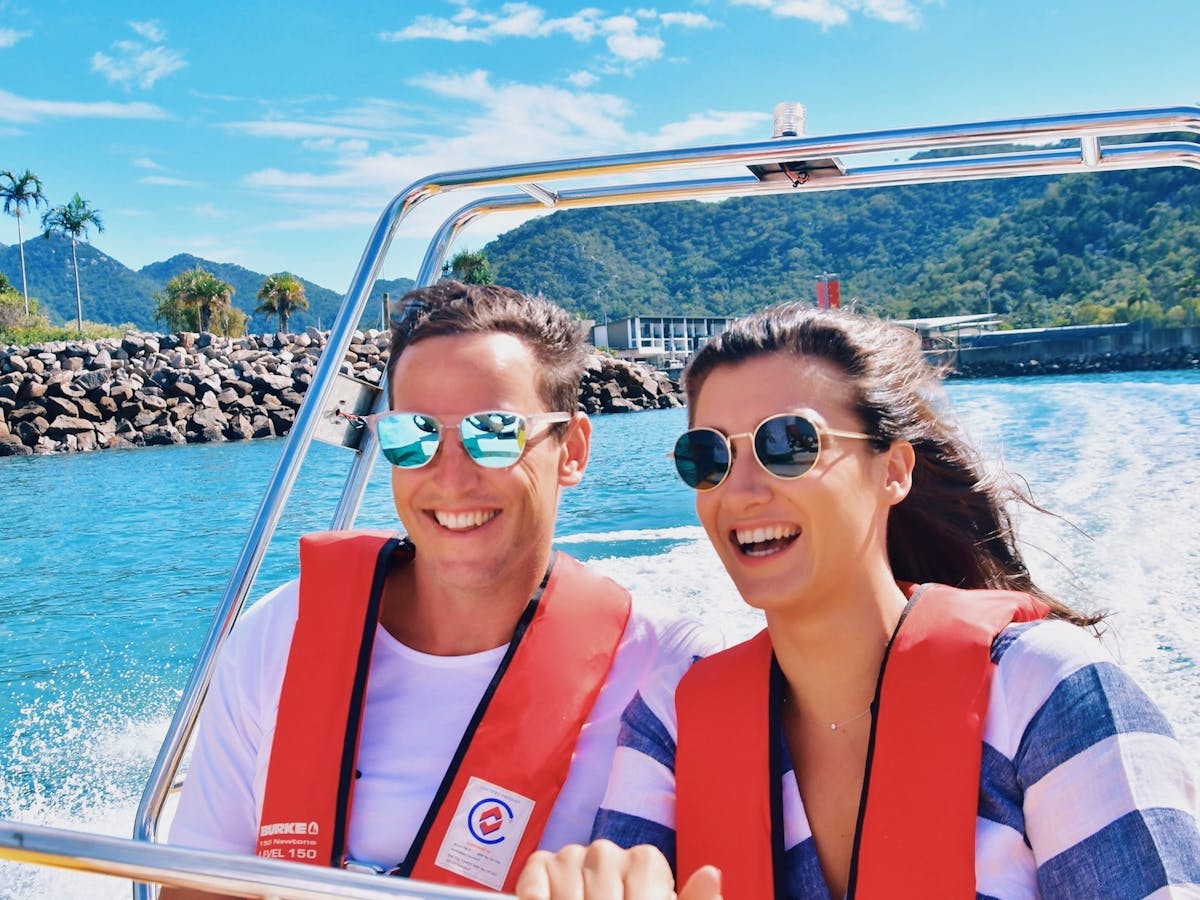 Couple on a boat heading off for an adventure