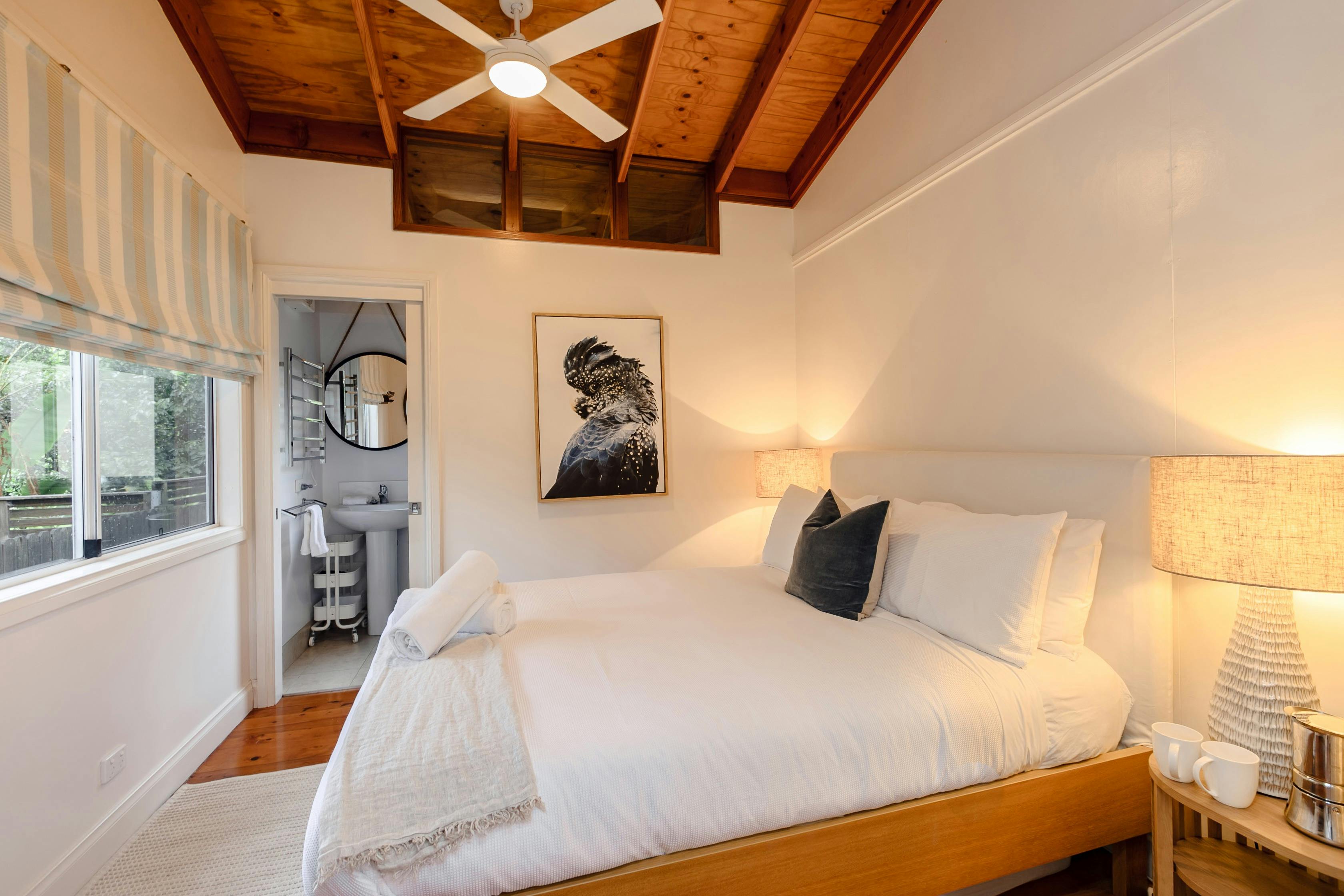 Bedroom showing white fresh linen and ensuite