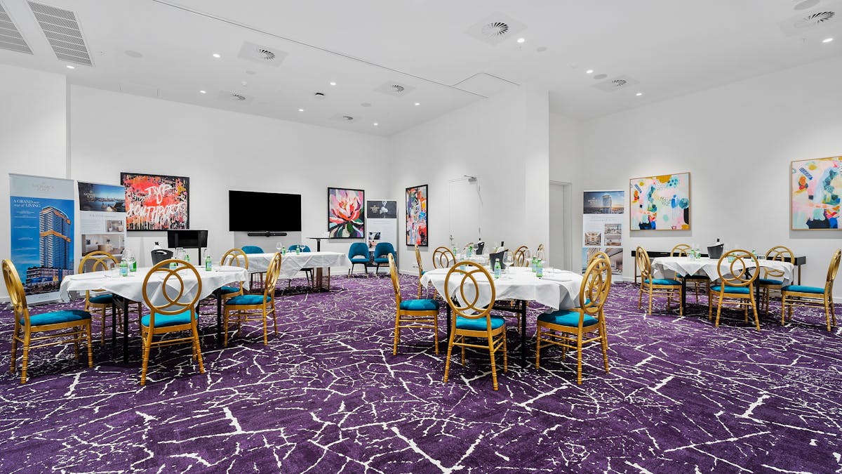 Elegant Regal Room equipped for meetings or events, featuring modern amenities and stylish decor.