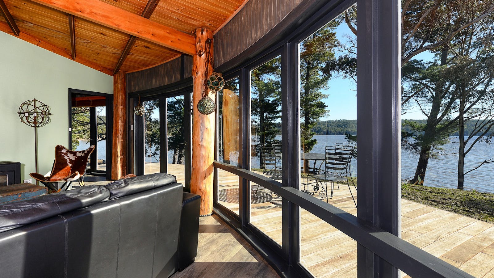 Taylors Bay Cottage: lounge area and view over Taylors Bay.