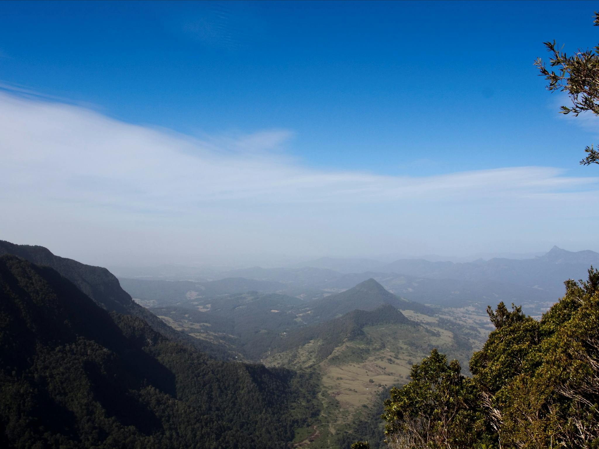 View of valley, mountains and farmland. View of valley, mountains and farmland.