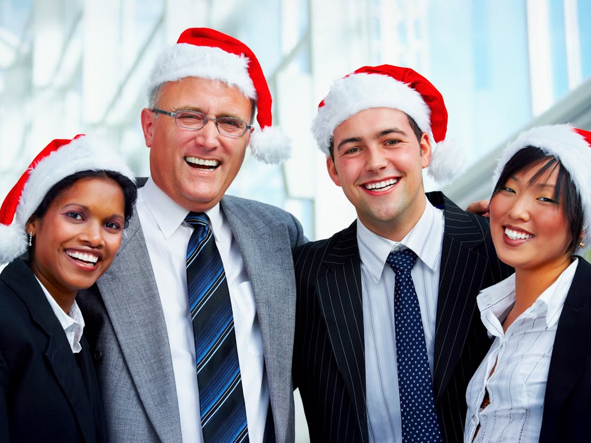 A corporate team celebrating on board a Christmas party cruise
