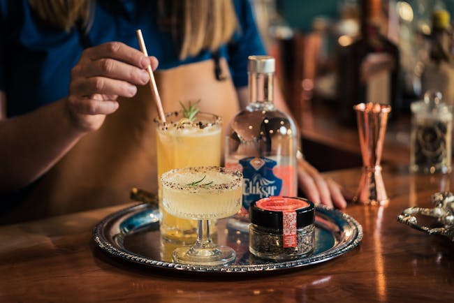 cocktails and gin on tray