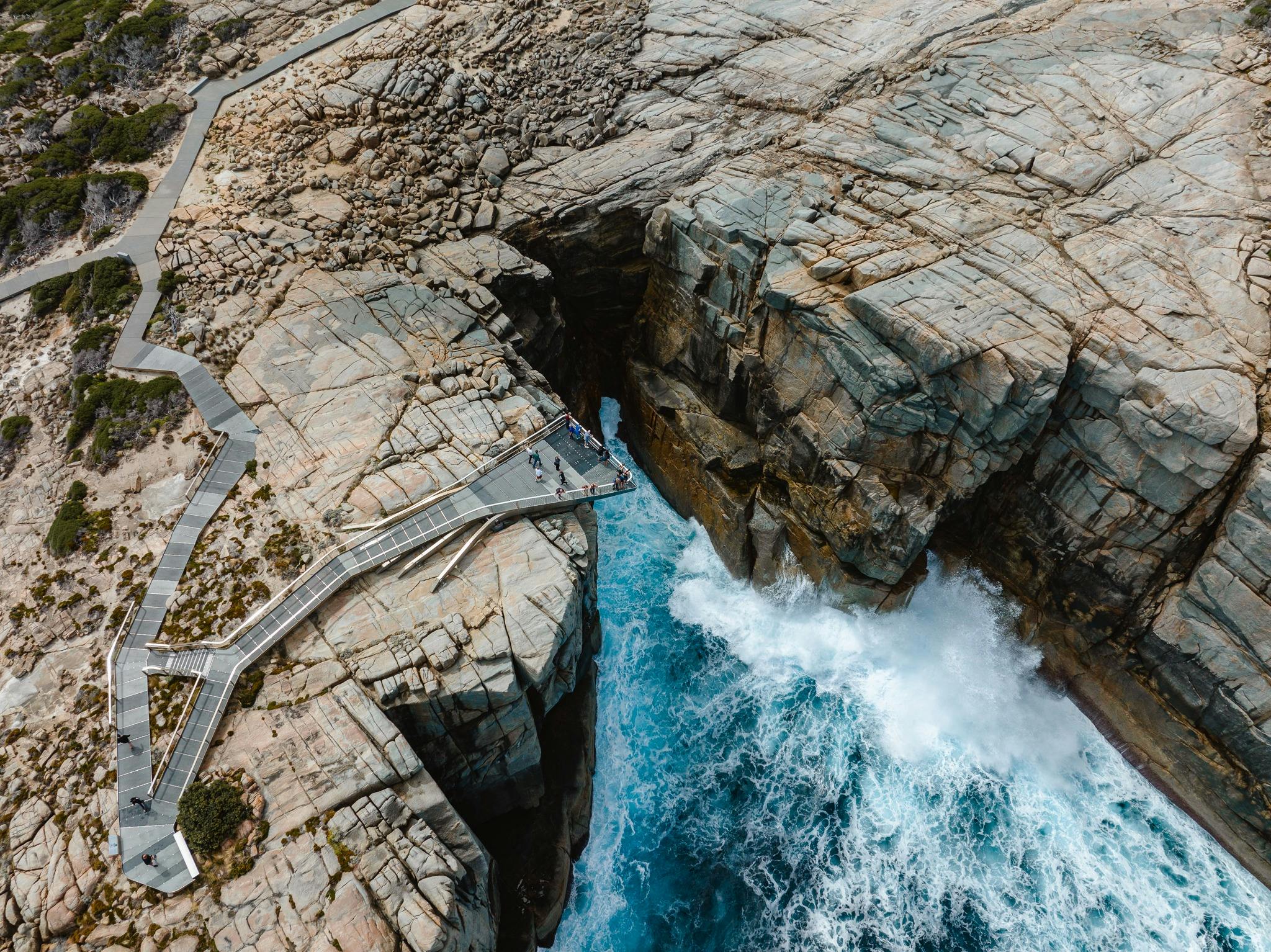 aerial view of granite coastline and ocean