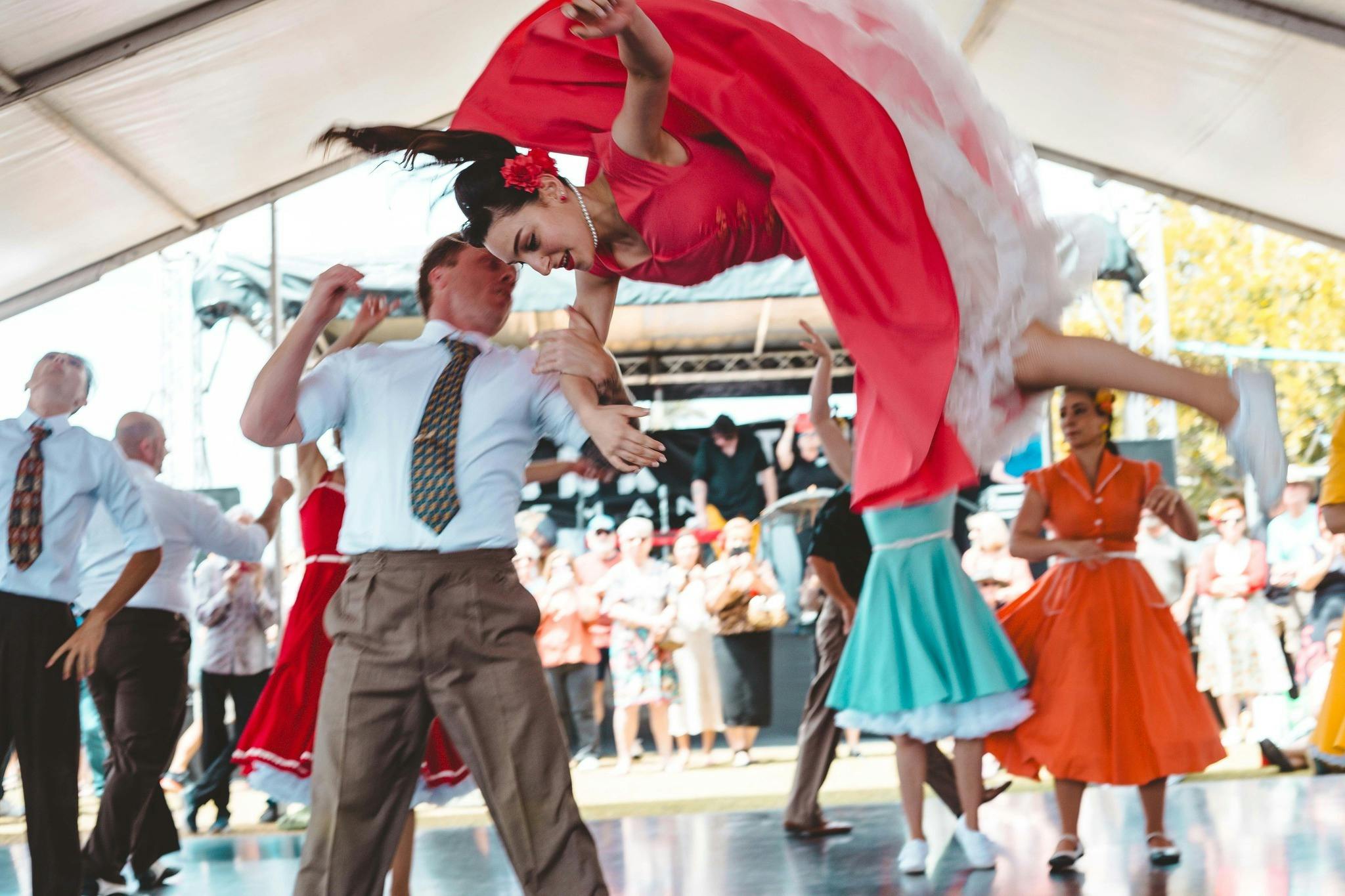 Female dancer in the air from the Sydney Swing Katz