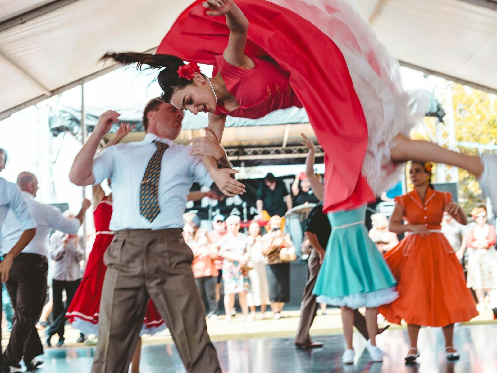 Female dancer in the air from the Sydney Swing Katz