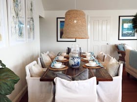 Dining table with seating for six in the open-plan dining area.