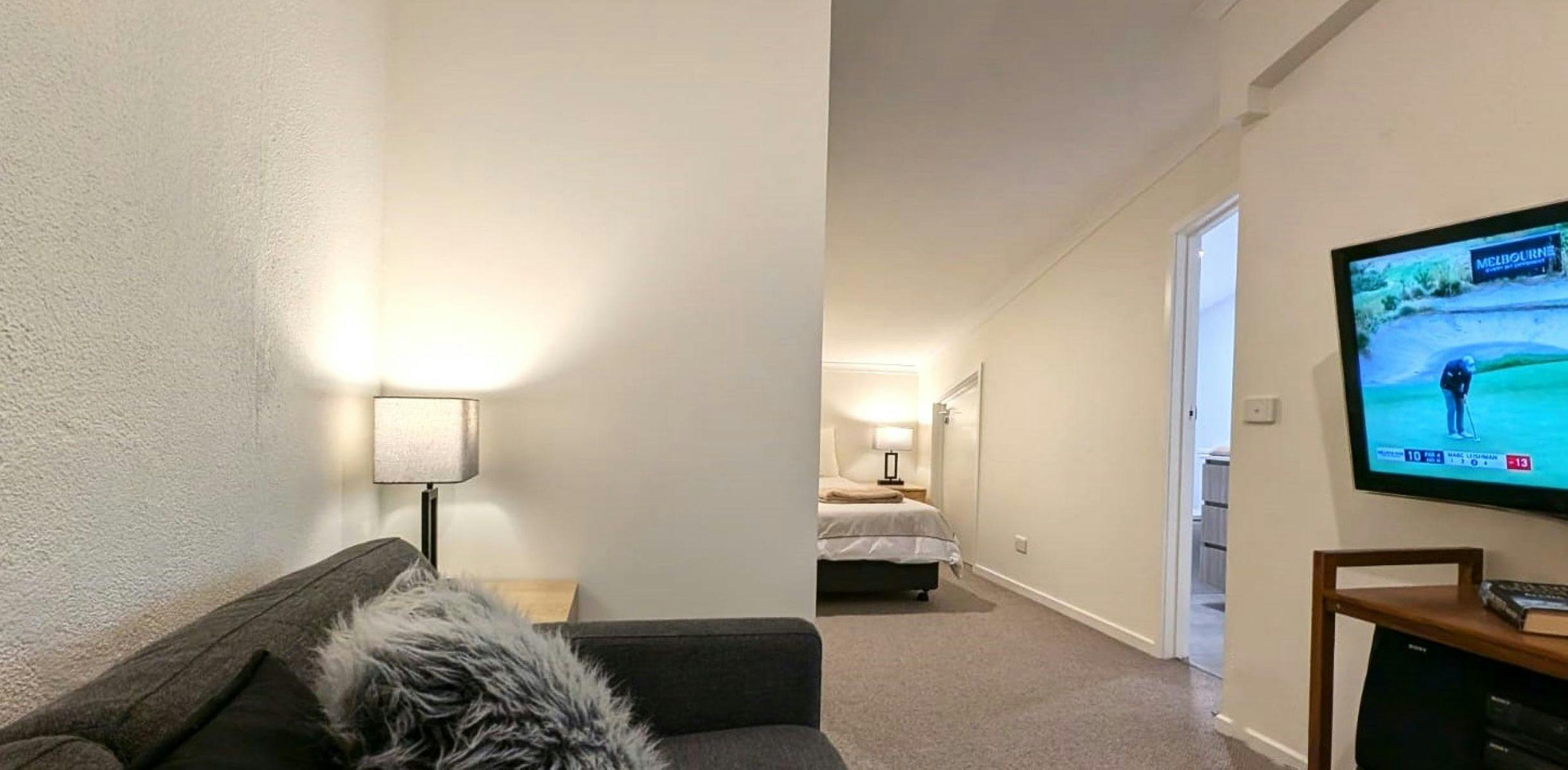 Lounge area with couch and television