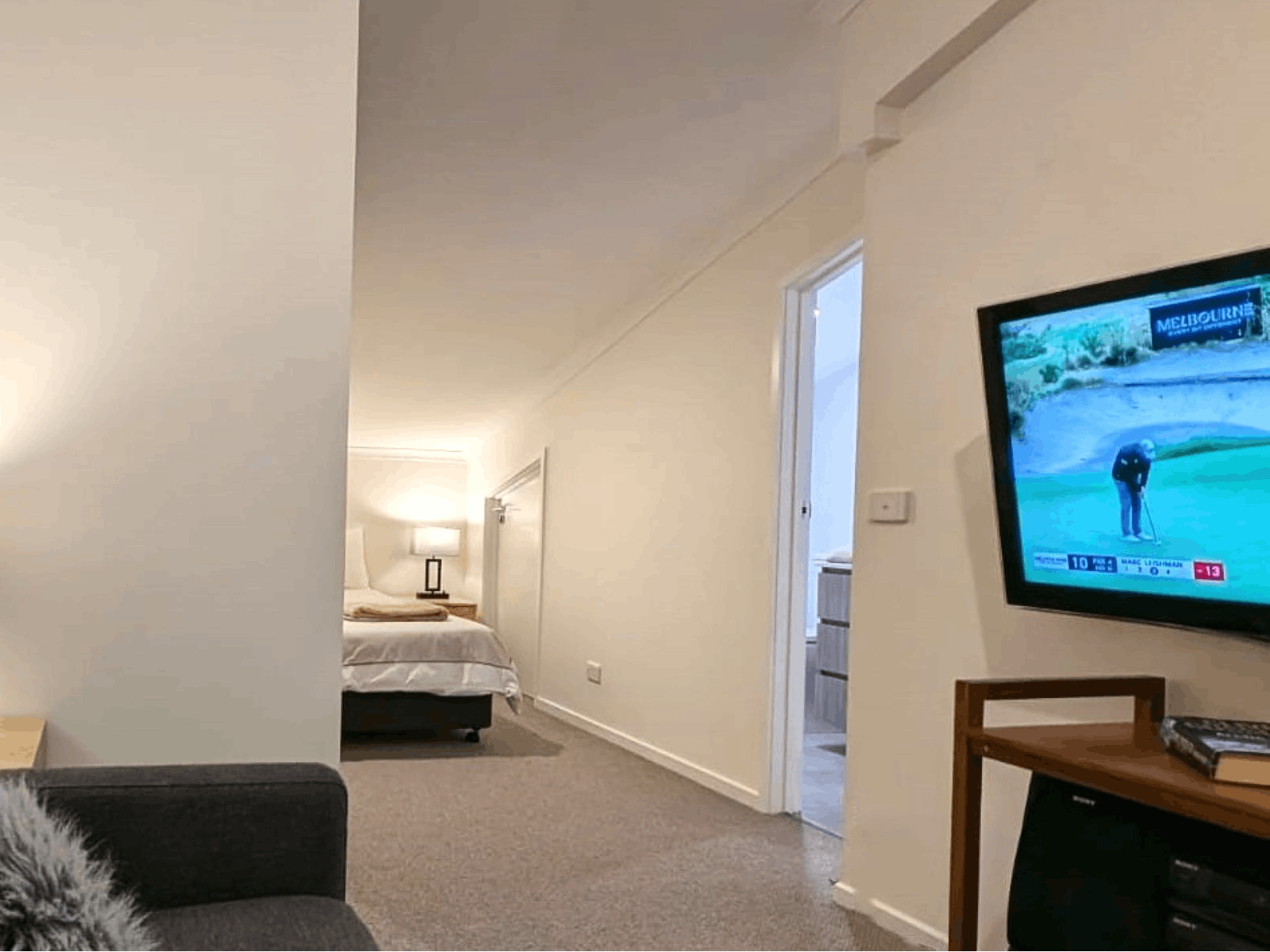 Lounge area with couch and television