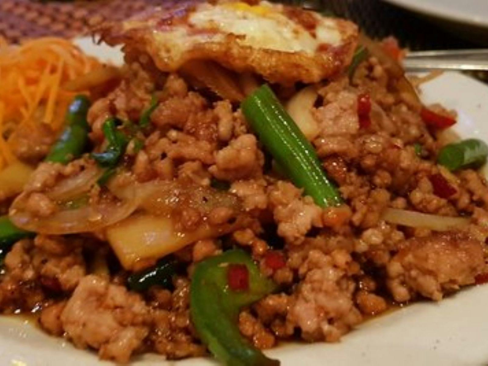 Pile of meat and noodles with vegetables