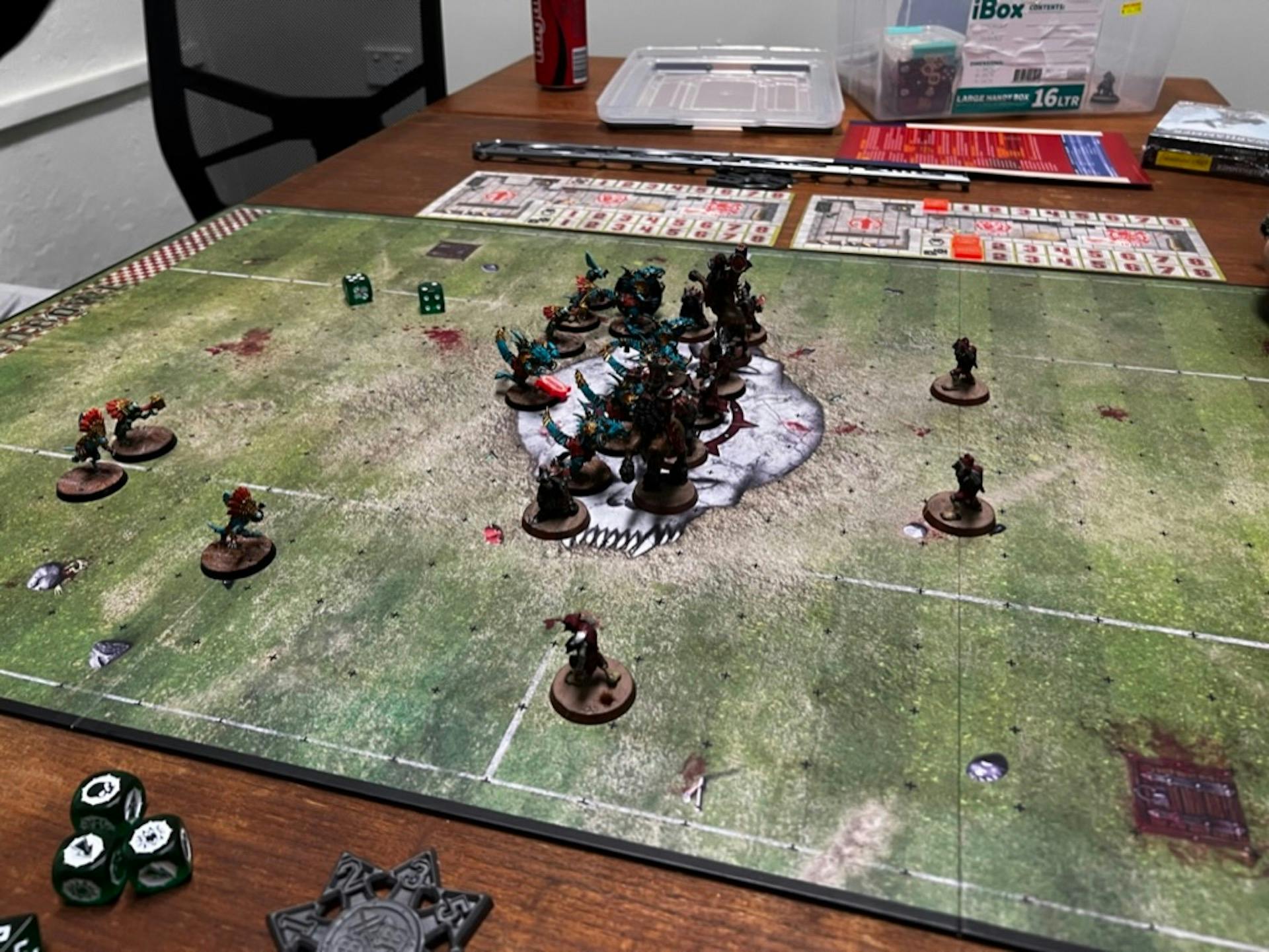 Blood Bowl tabletop game in progress with miniatures and dice.