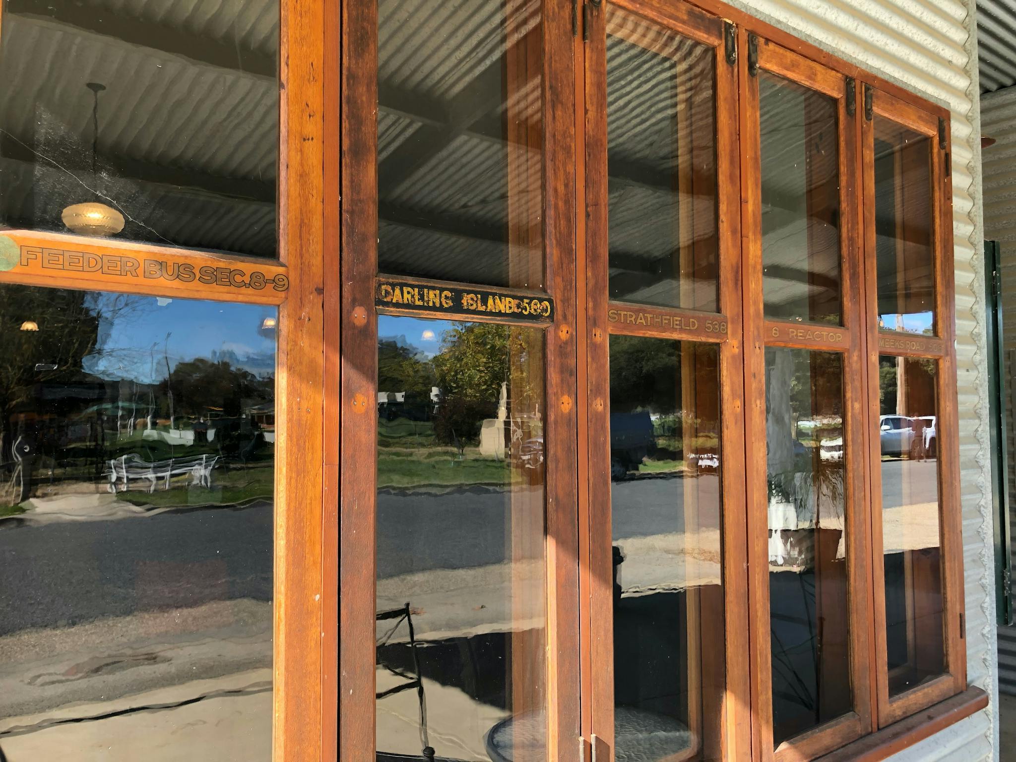 Wood-framed windows at the front of the cafe.