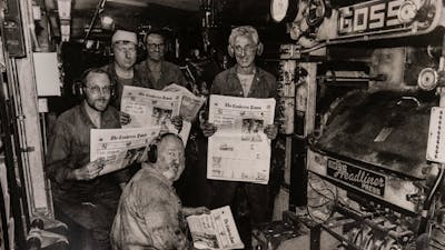 1996 Canberra Times printing press with workers holding copies of the newspaper