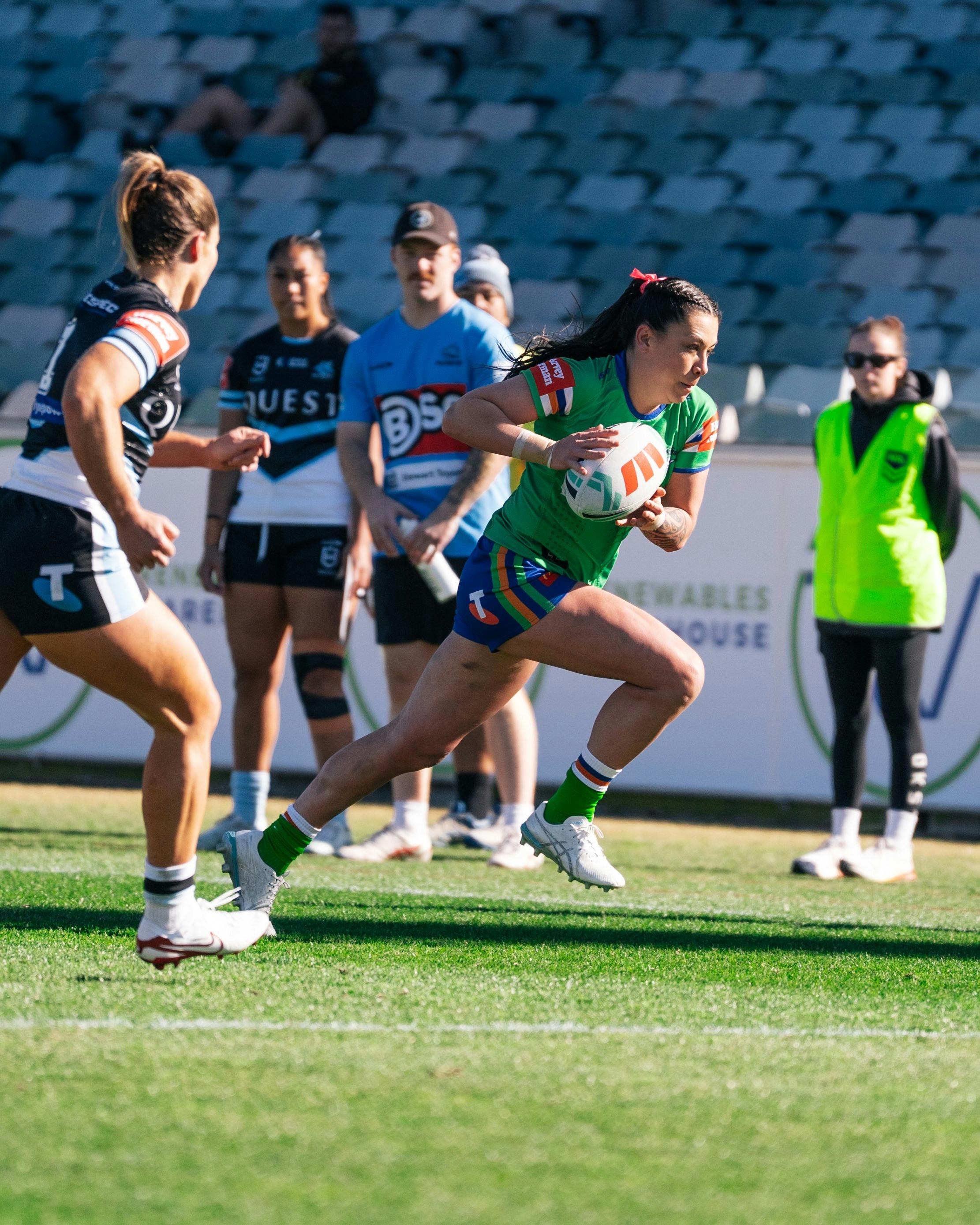 Canberra Raiders player Madison Bartlett running the ball.