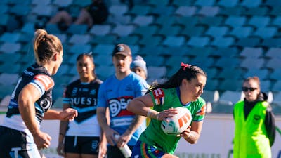 Canberra Raiders player Madison Bartlett running the ball.