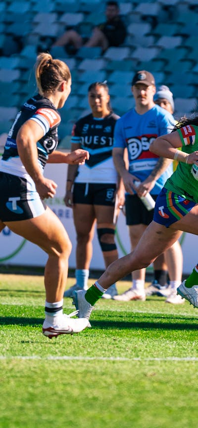 Canberra Raiders player Madison Bartlett running the ball.