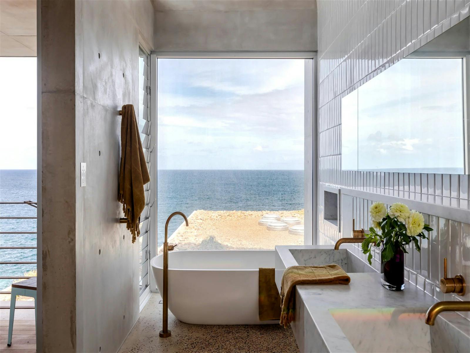 Soothing bathtub with panoramic ocean views and crashing waves