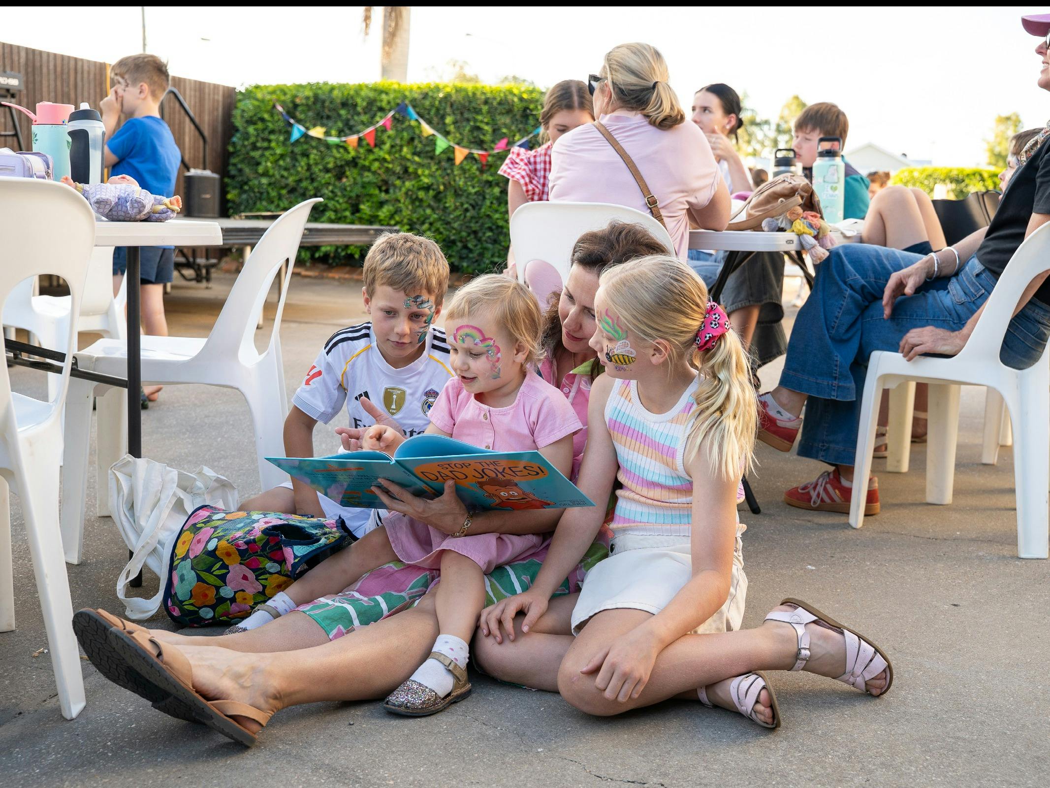 Family reads together at the Storyfest Central QLD Prologue Party.