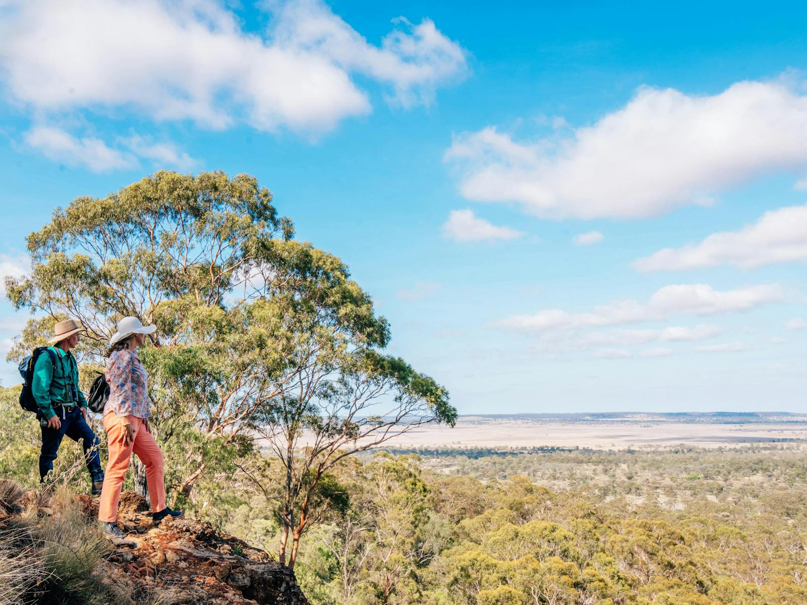 Two people looking out at the view from the top of Mt Abundance near Roma
