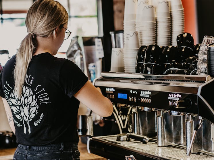 barista at the coffee machine