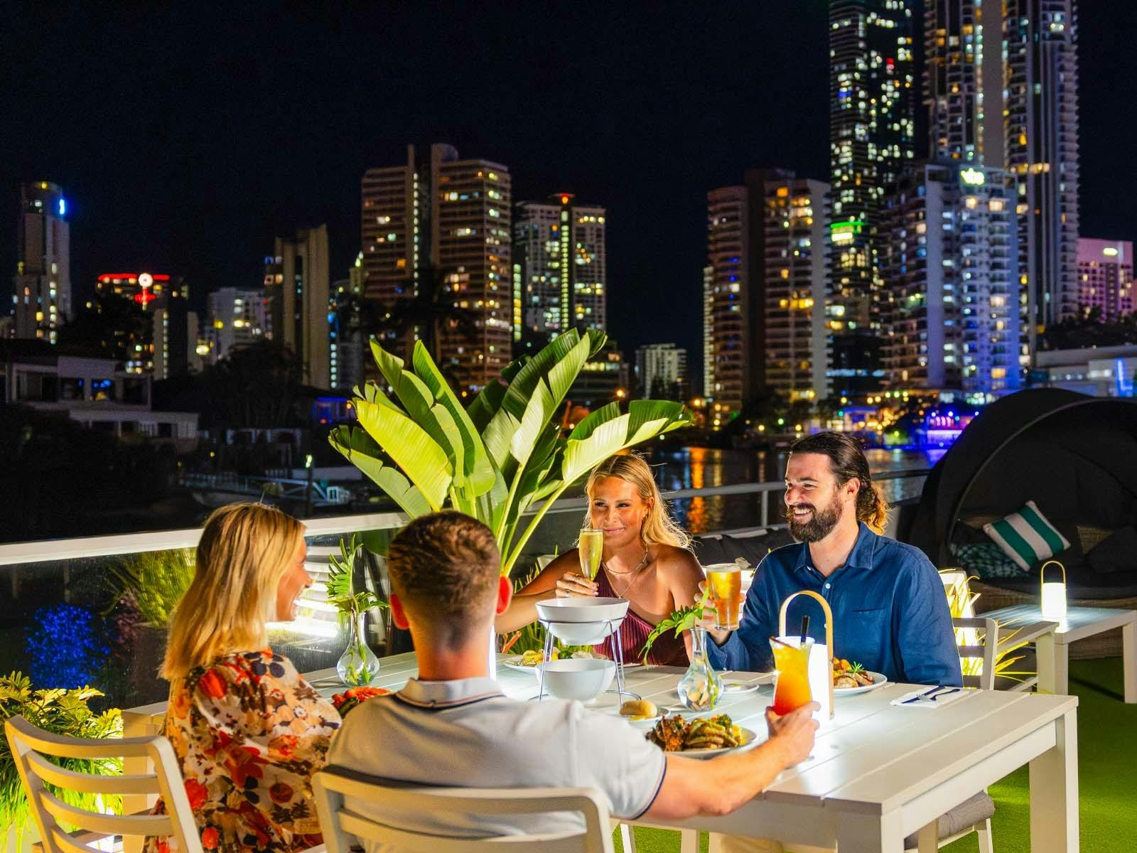 Friends enjoying a night out on the Gold Coast waterways Friends enjoying a night out on the Gold Coast waterways