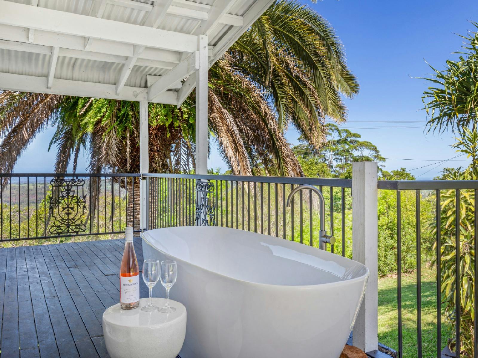 Balcony with free standing bath overlooking the view Balcony with free standing bath overlooking the view