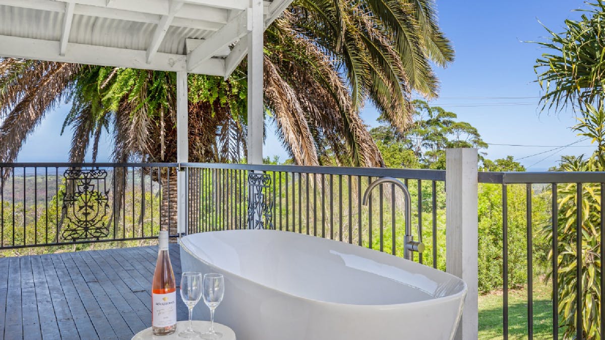 Balcony with free standing bath overlooking the view