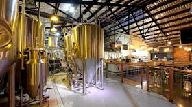 Interior of FogHorn Brewhouse with fermentation tanks in brewery area