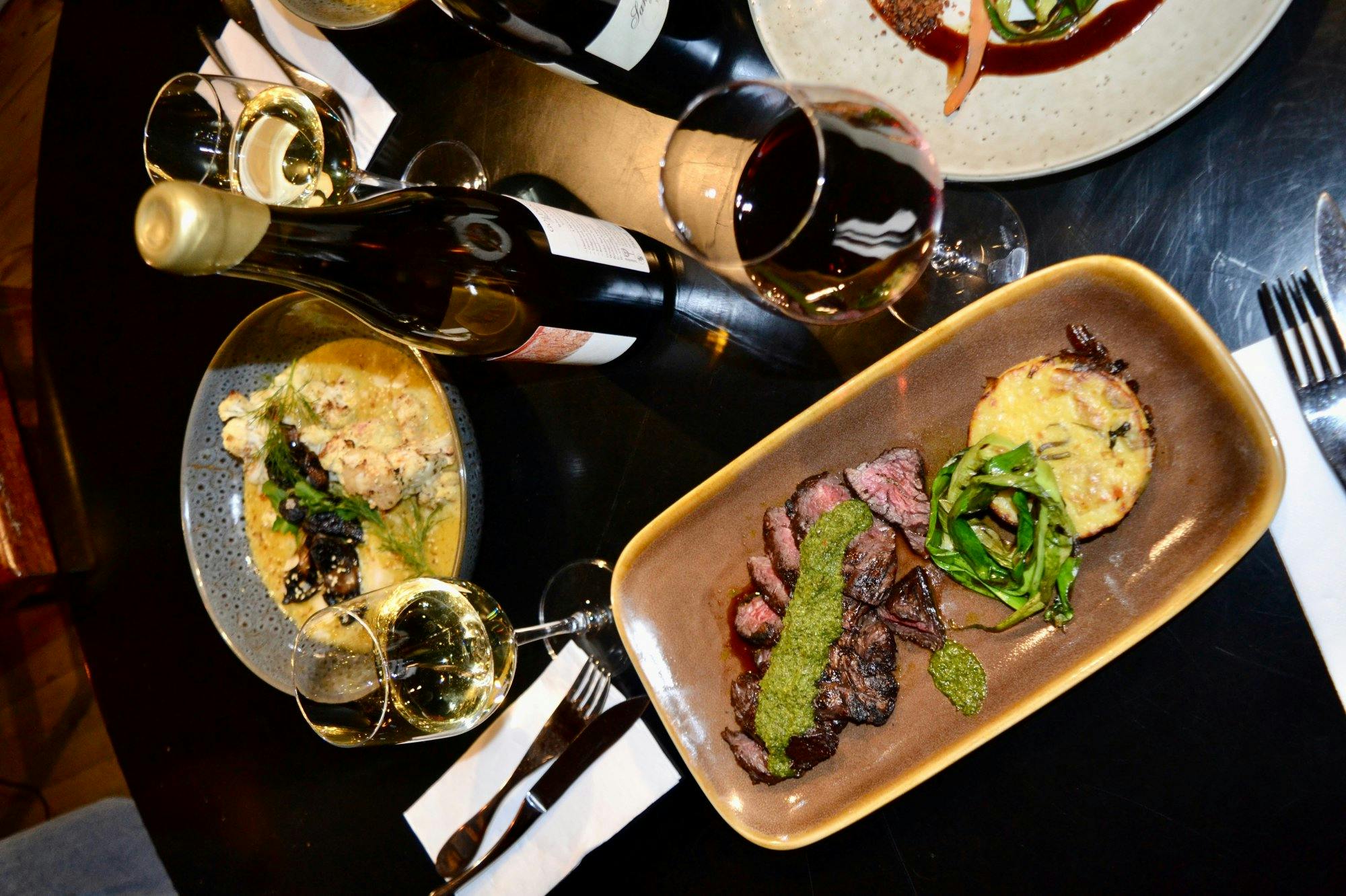 Feathertop’s steak and rainbow trout dishes featuring chimichurri and coconut cream.