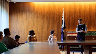 A group of people seated at the Cabinet Room