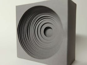 Photograph of grey paper sculpture