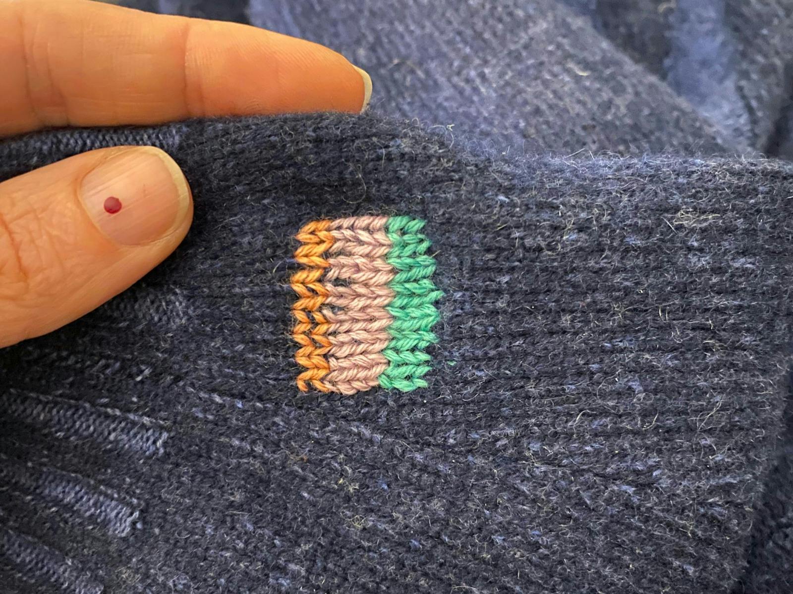 Visible mend on knitwear example