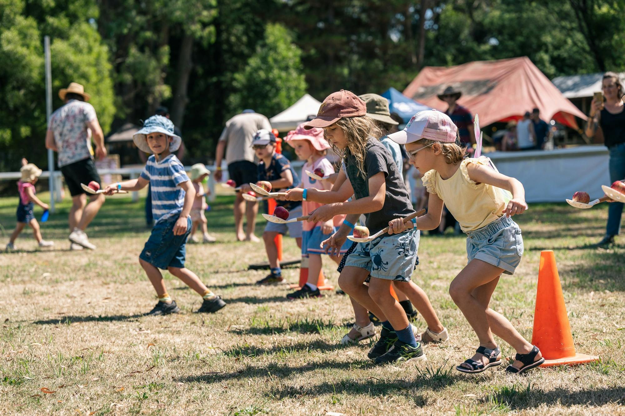 Cildren lined up ready for the Apple and Spoon Race at Spring Ditch 2023