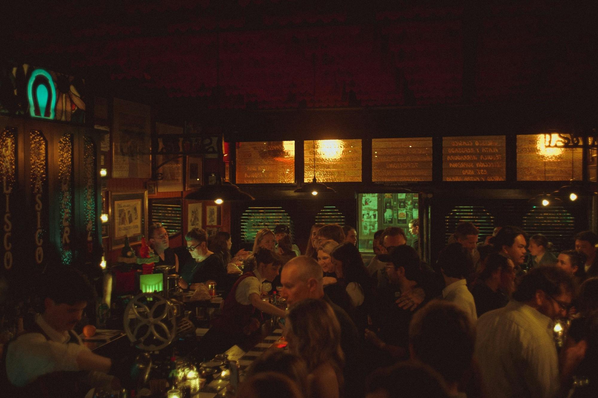 Guests enjoying cocktails inside Super 44's lively neighbourhood margarita bar.
