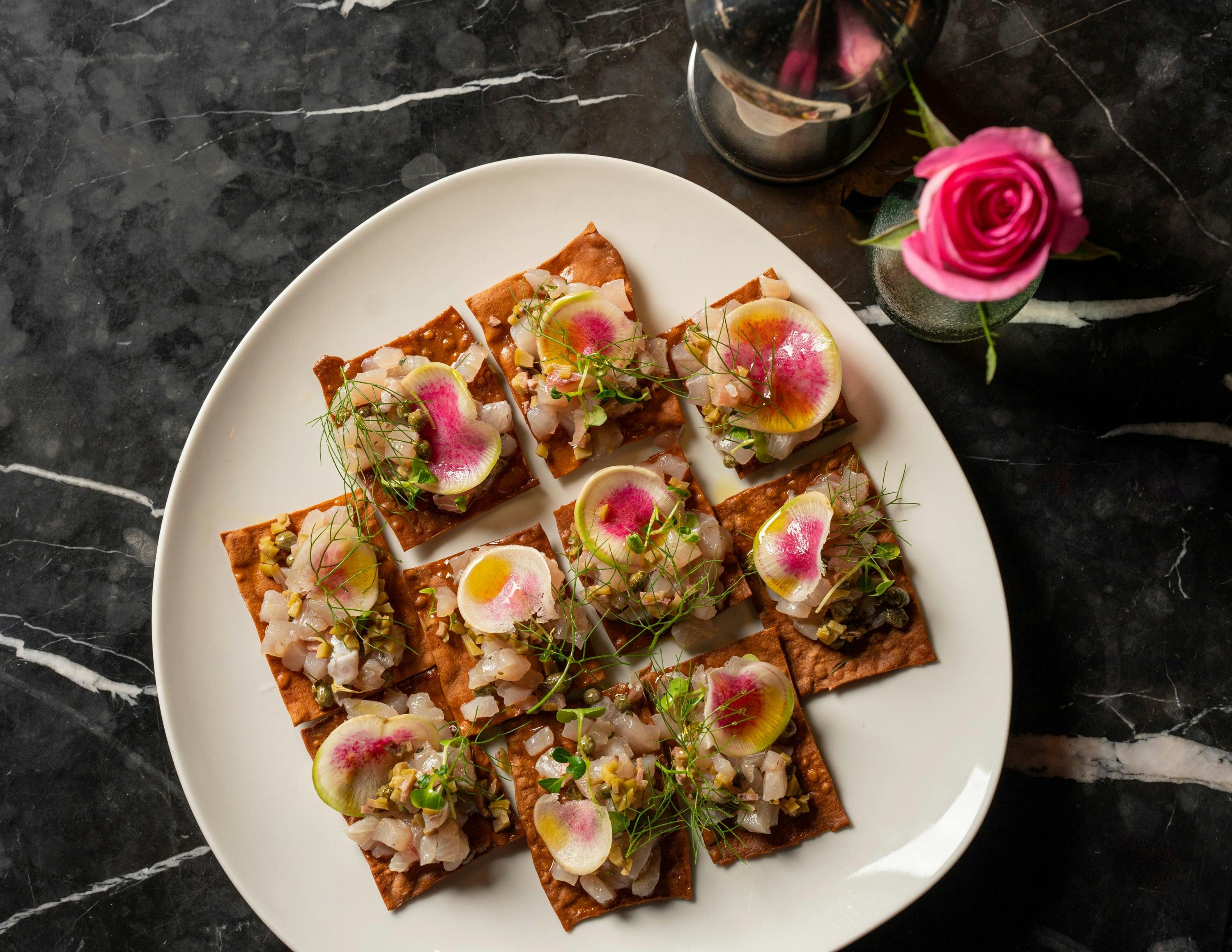 Wild Caught Kingfish Crudo, Olive Puree, Sicilian Capers, House Made Flat Bread