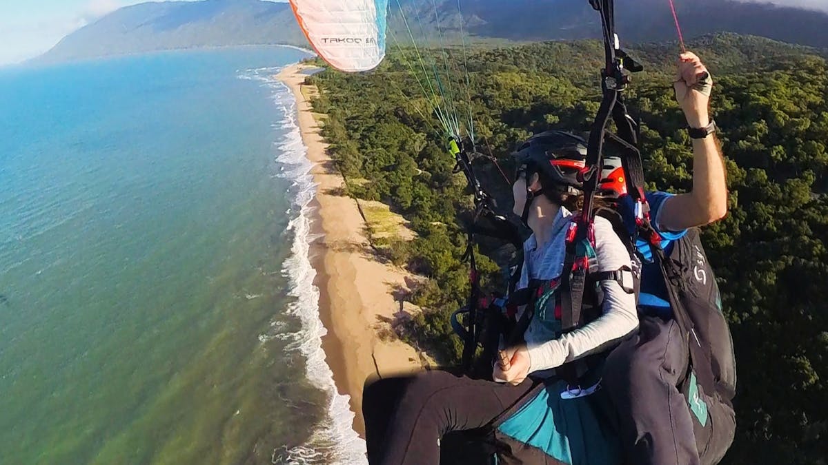 tandem paragliding along the coast
