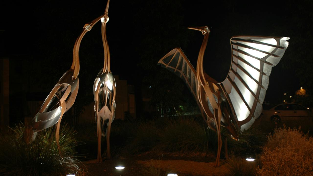 The "Brolgas" sculpture, image taken at night.