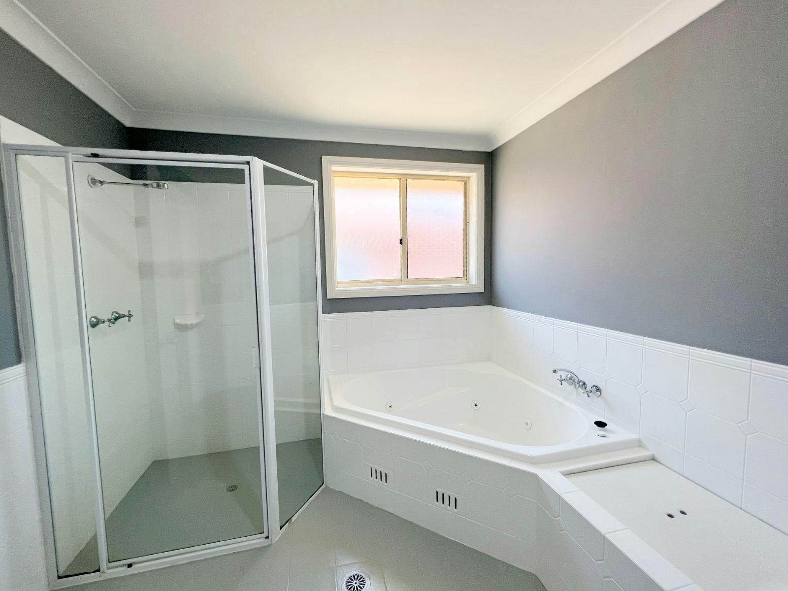 Bathroom with shower and bath