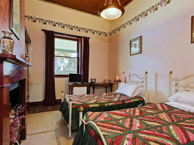 Twin beds with separate private bathroom (Ruby Room) image