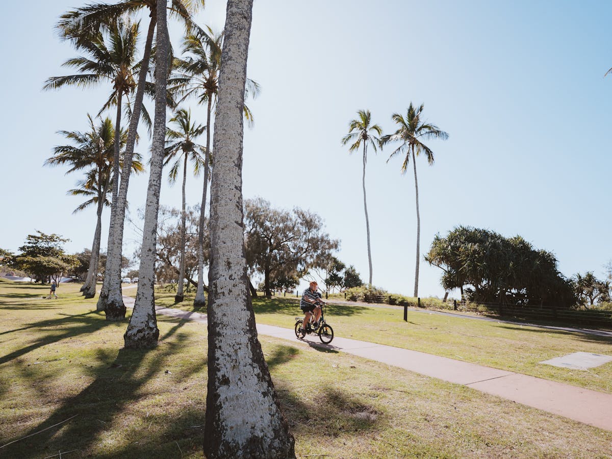 Guests riding a bike at the park