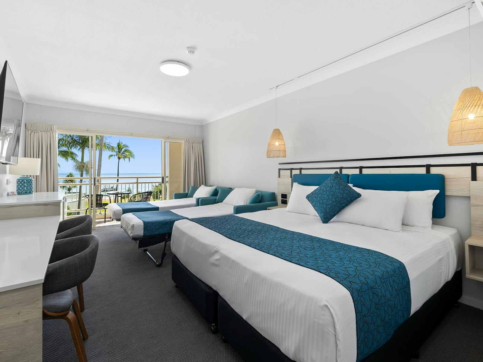 Hotel room with king bed, pull out singles and ocean view Hotel room with king bed, pull out singles and ocean view