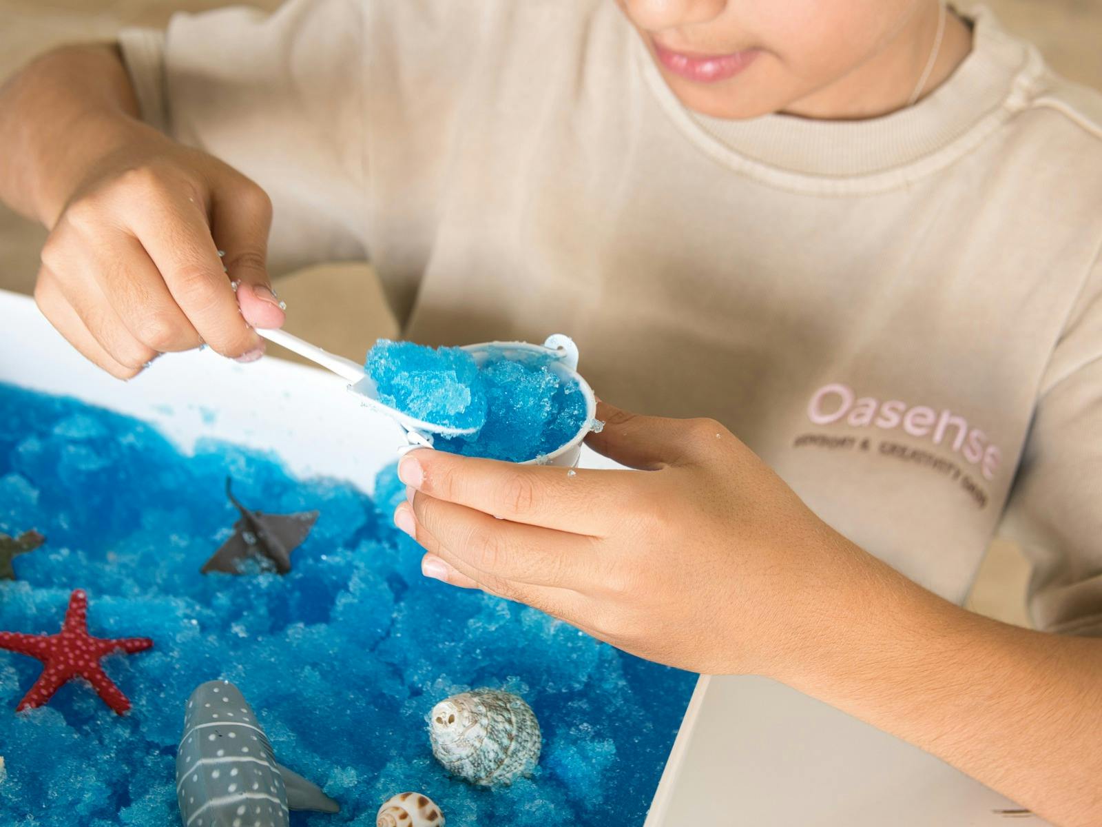 A child playing and exploring at the Oasense activation at SEA LIFE Sydney Aquarium