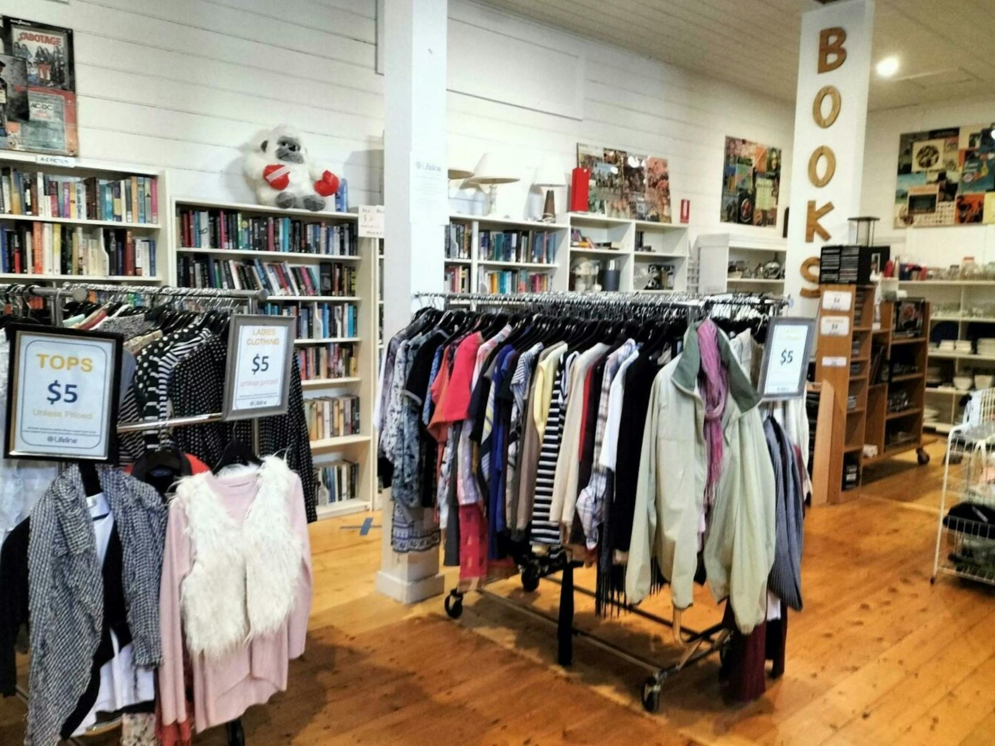 Image of coat racks and clothing for sale