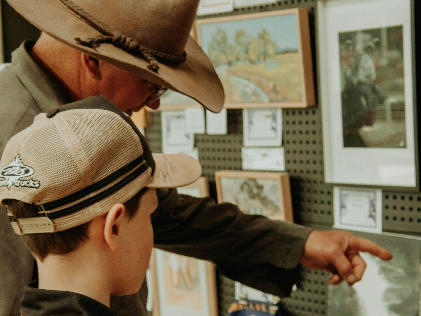 Man and child looking at photos