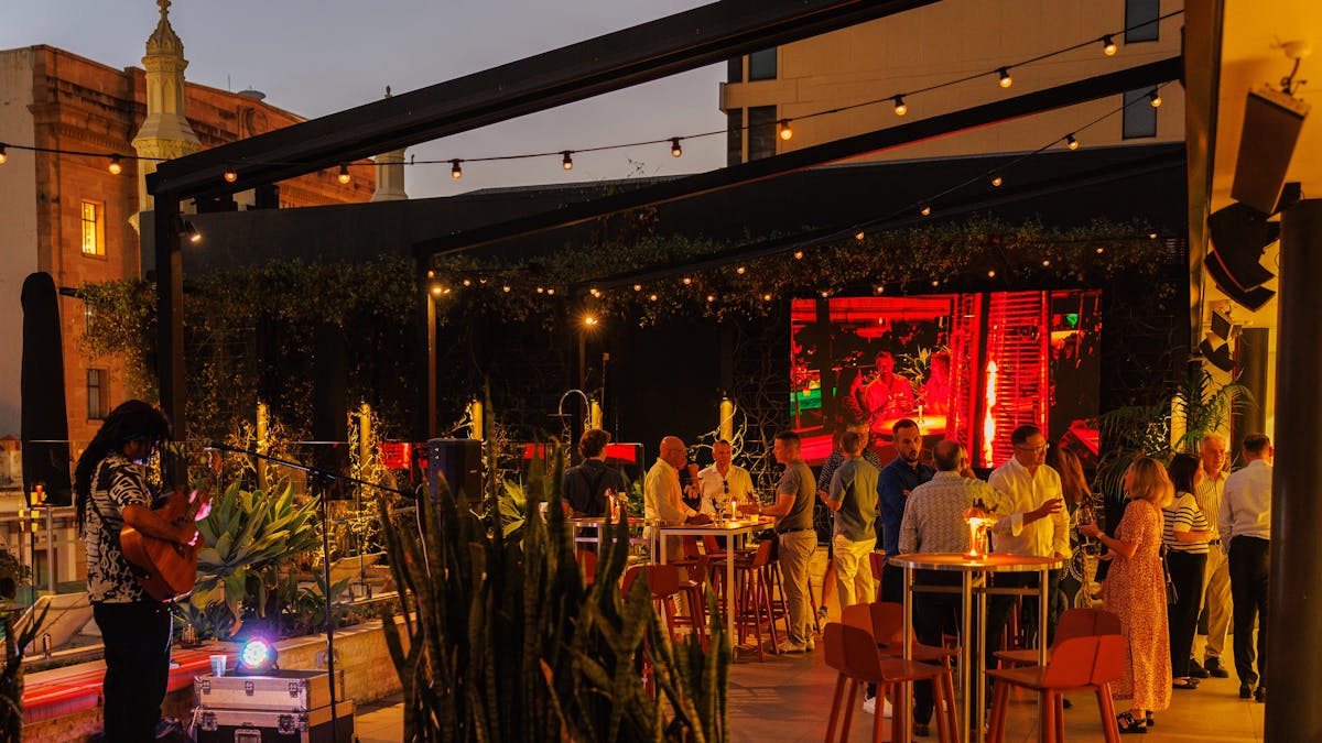 Group of people enjoining the evening at Hibiscus Bar &  Terrace - Hyatt Rgency Brisbane