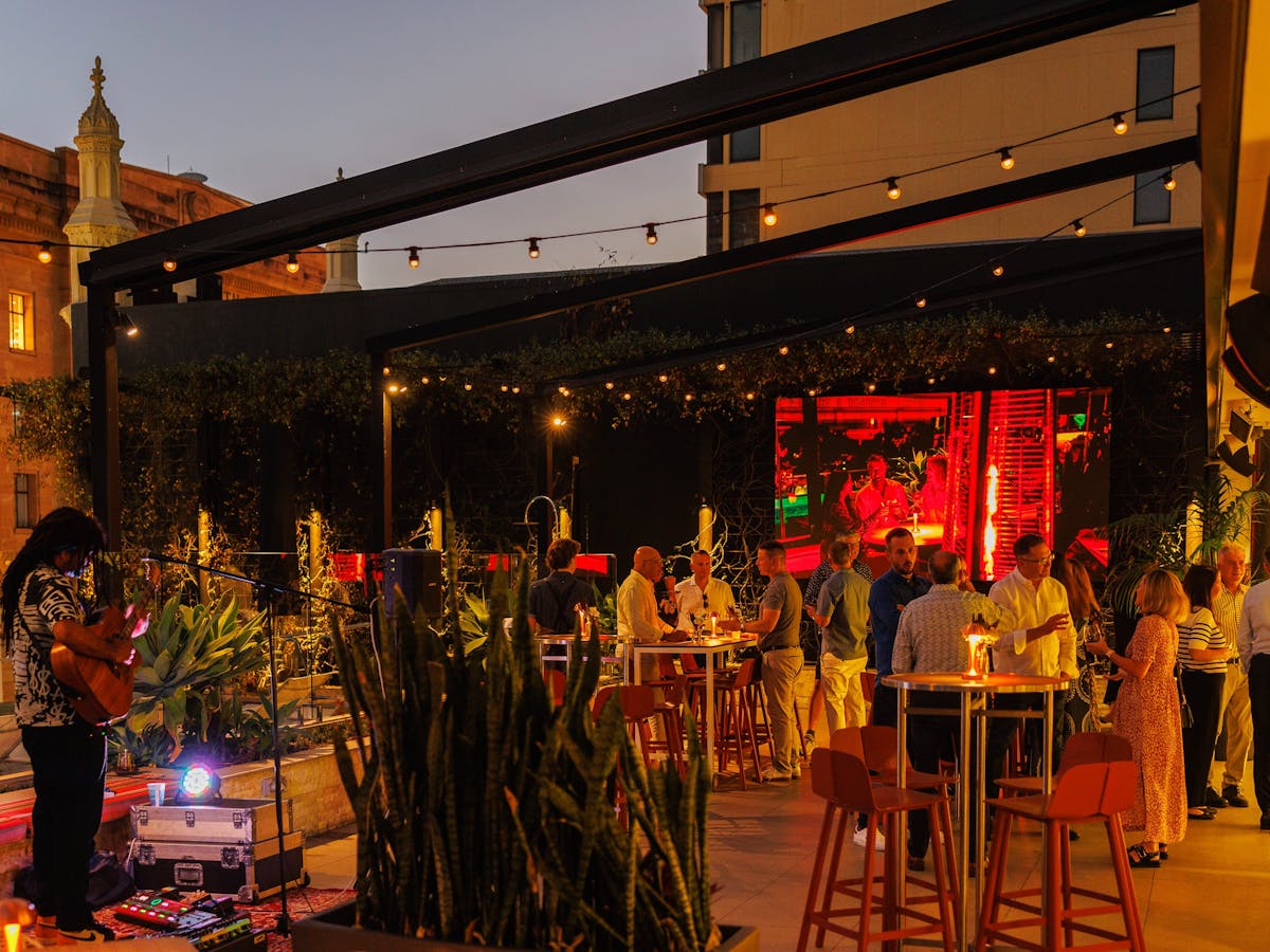 Group of people enjoining the evening at Hibiscus Bar &  Terrace - Hyatt Rgency Brisbane