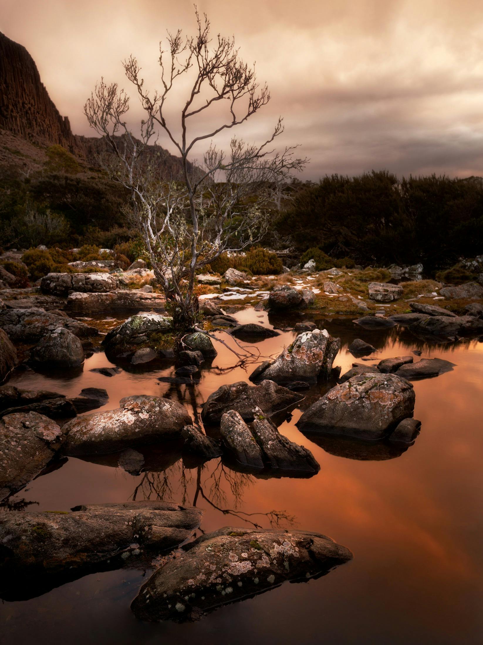 Sunset reflection on a Tarn on Ben Lomond