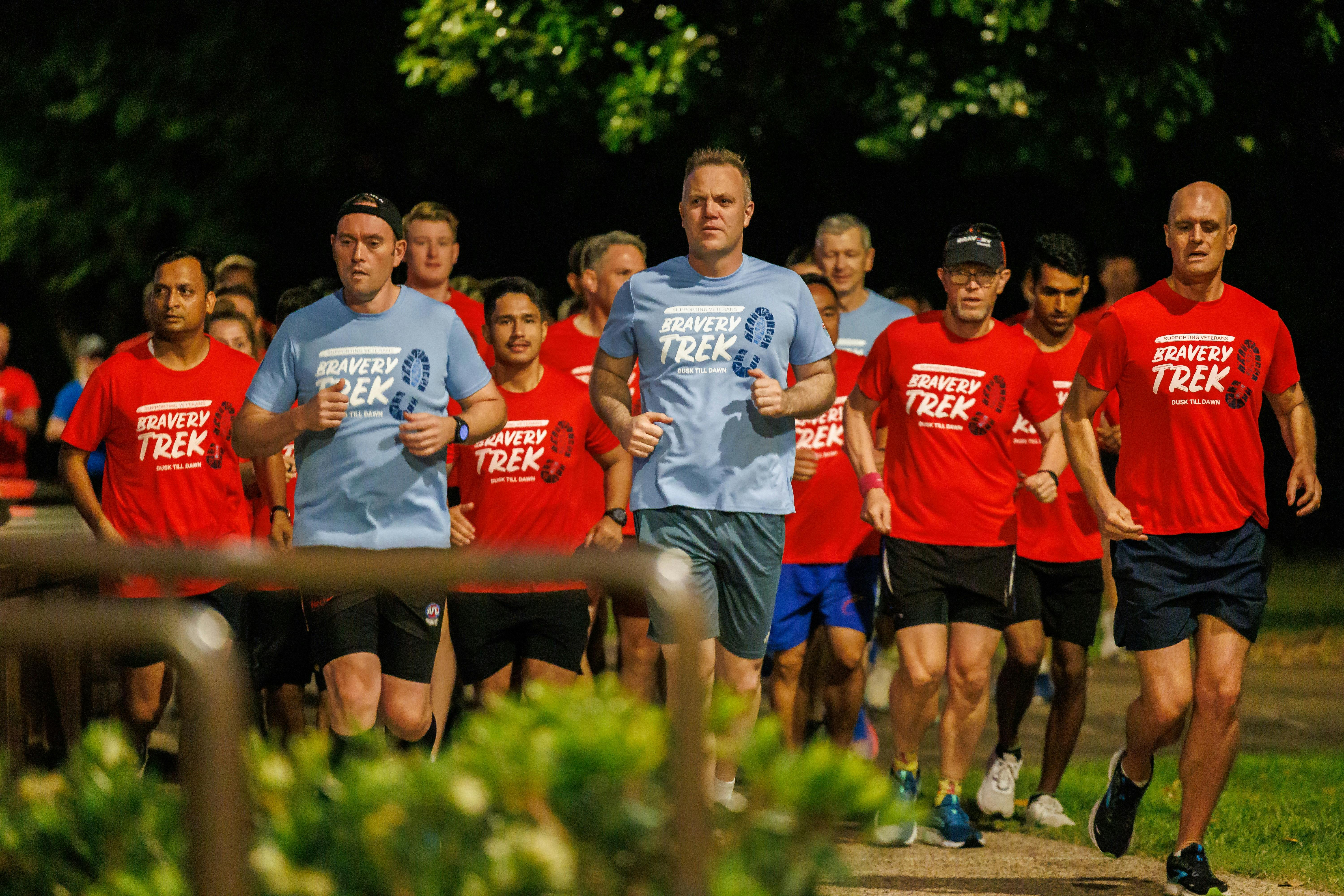 Group of people running in Dusk till Dawn tshirts